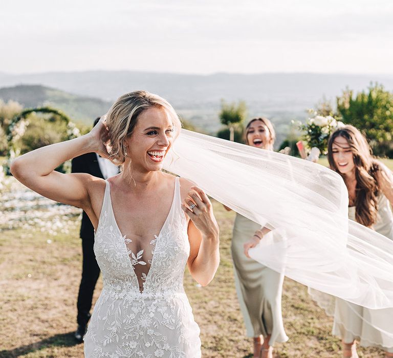 Blonde bride in fitted lace wedding dress with mesh insert to the front 