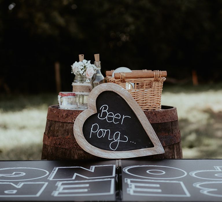 Chalkboard beer pong signage for outdoor games at The Apple Orchard 