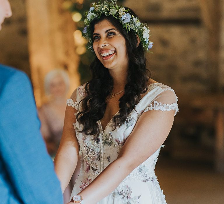 British Indian bride wearing a flower crown and Savin London Amelia dress