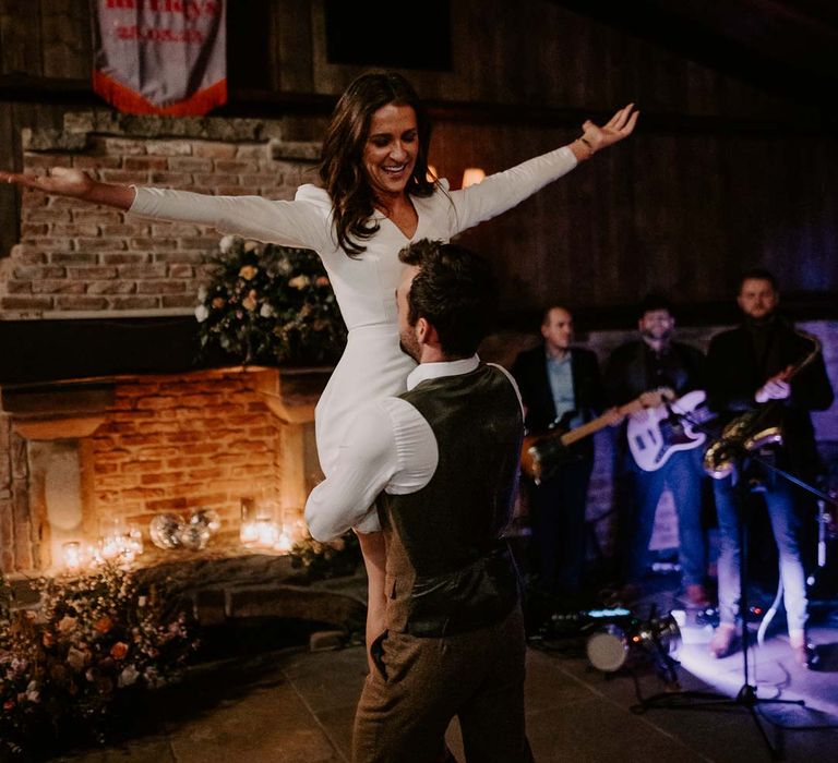 Bride and groom doing wedding choreographed first dance to upbeat first dance wedding song at Willow Marsh Farm Loughborough 