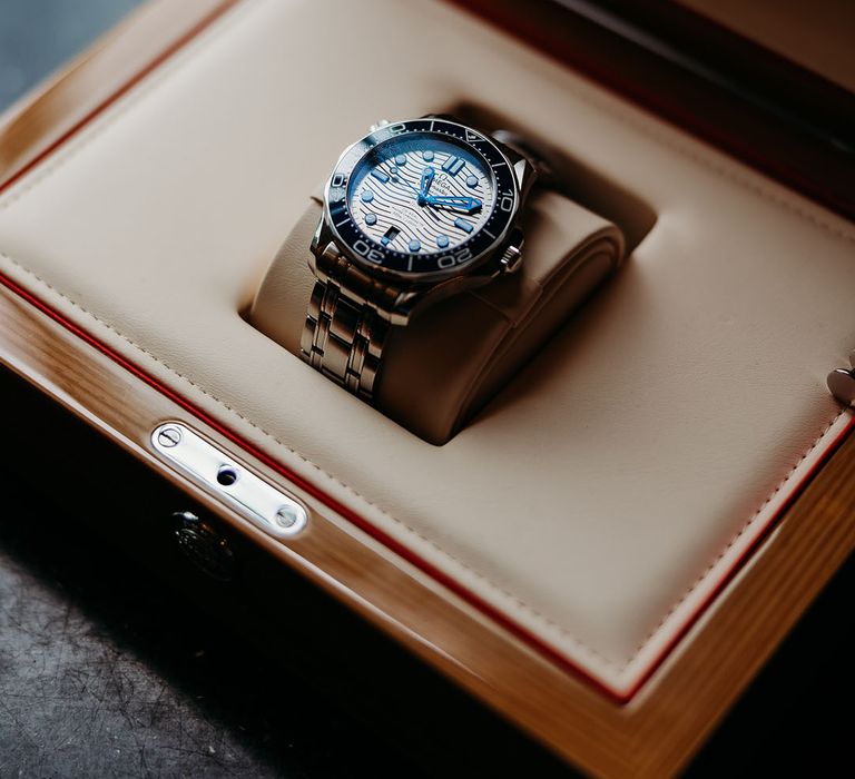 Blue and silver Omega watch groom's accessory for the wedding day 