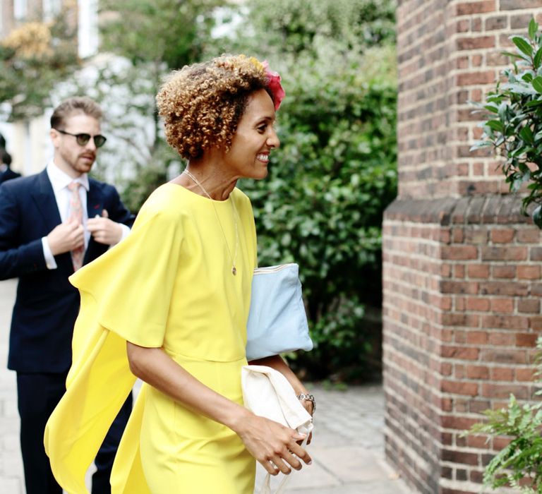 Bright vibrant yellow bridesmaid dress worn by bridesmaid 