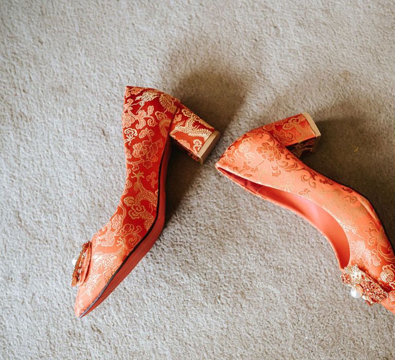 Red and gold patterned block heel shoes for the bride 