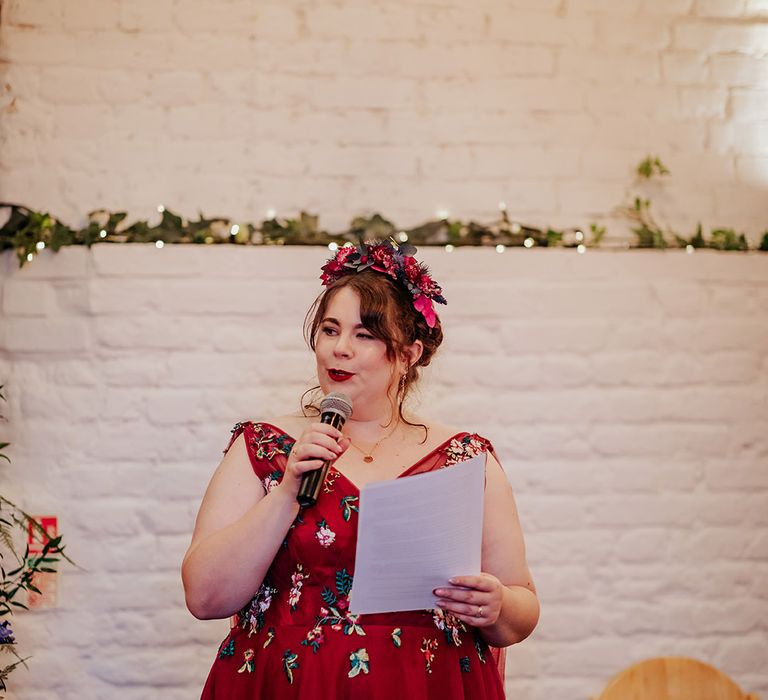 Bride reading wedding speech with flower crown 