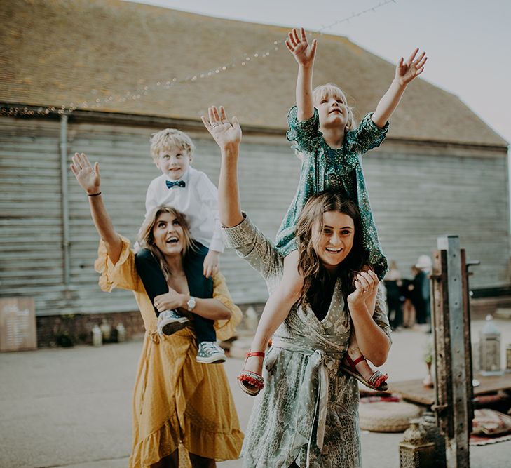 Wedding guests playing at barn wedding 