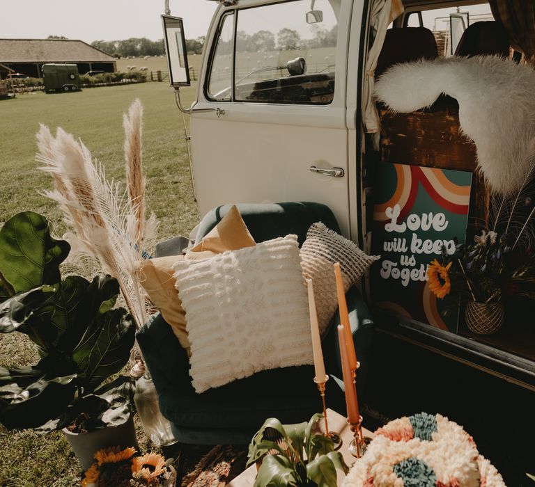 Dried grasses, macrame and faux fur rugs for 70s wedding inspiration in a VW camper van