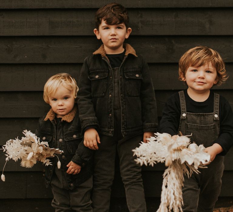 Stylish children in black dungarees at micro wedding 