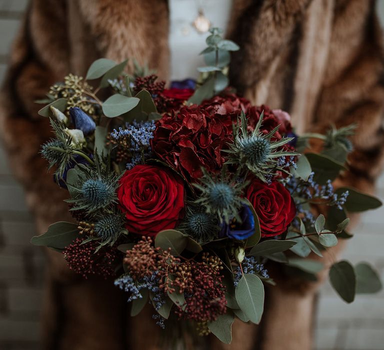 Winter wedding bouquet with red roses