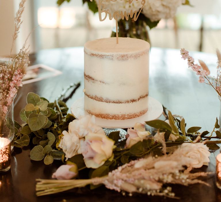 single tier semi-naked wedding cake with personalised laser cut cake topper 