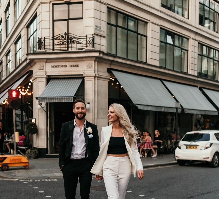 Bride & groom walk through the streets of London together