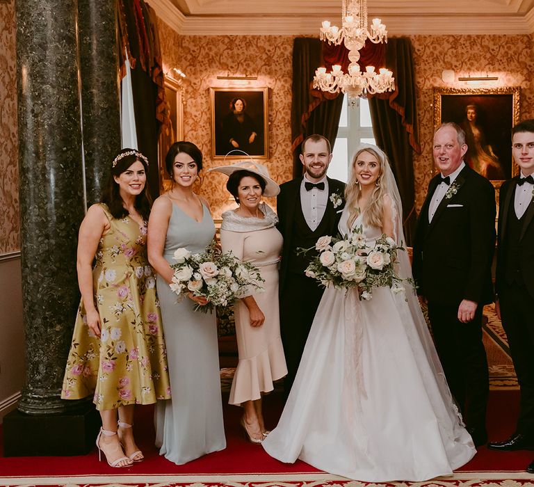 Bride & groom stand with wedding party for intimate six person wedding at the Markree Castle in Ireland