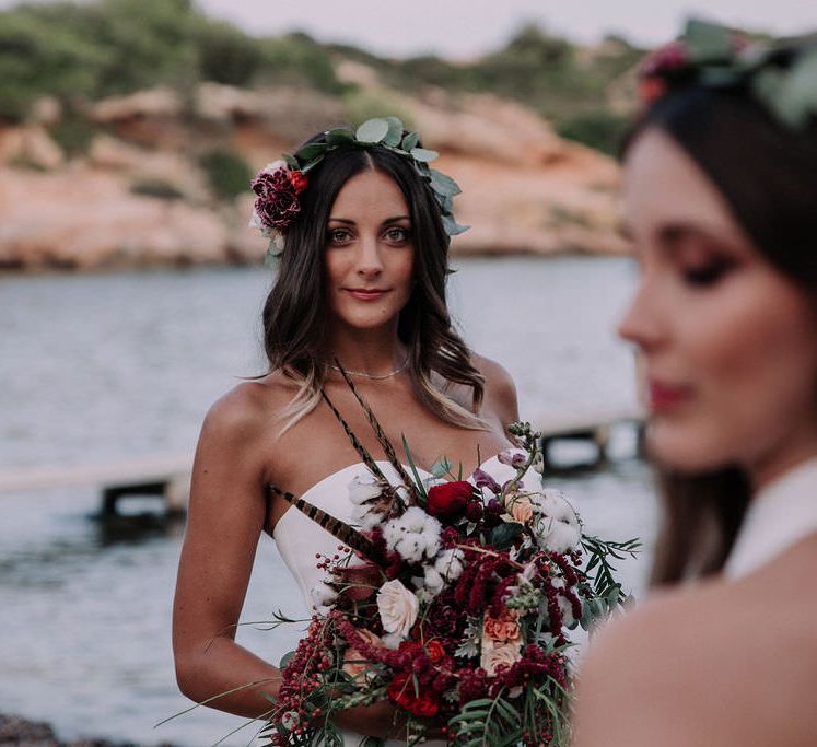 Brides with eucalyptus head bands with deep toned red bouquet