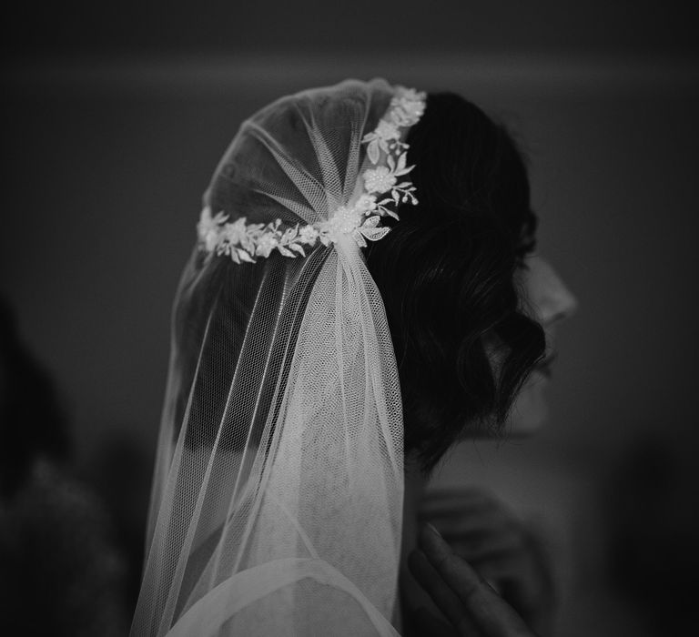 Bride in a Juliet wedding veil with lace cap detail 