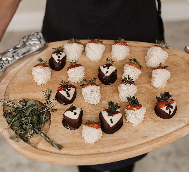 Touchays wedding catering with chocolate covered strawberries on wooden board