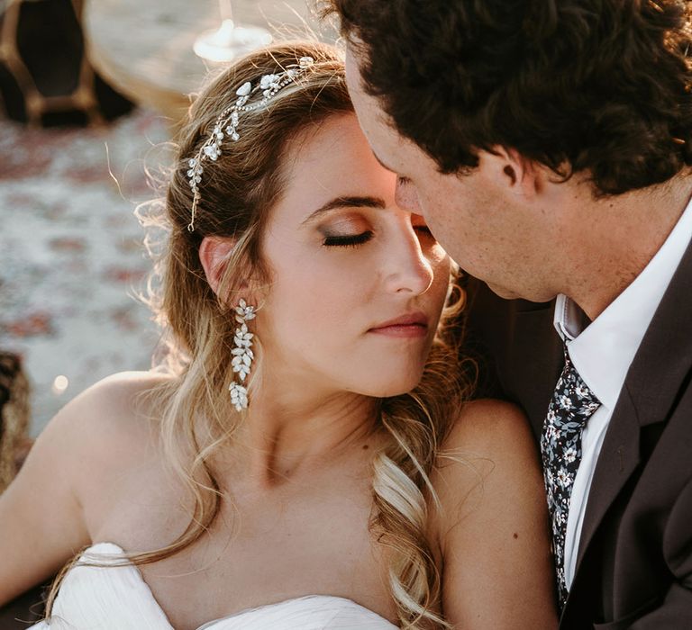 Bride & groom lean in to one another on their wedding day