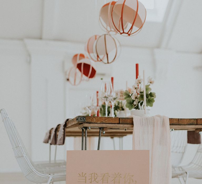 Paper lanterns and peach and gold Chinese wedding sign