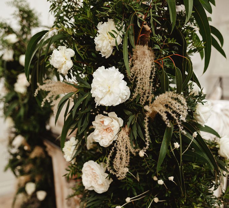 Large column flower display for altar decoration with white flowers, greenery and dried flower 