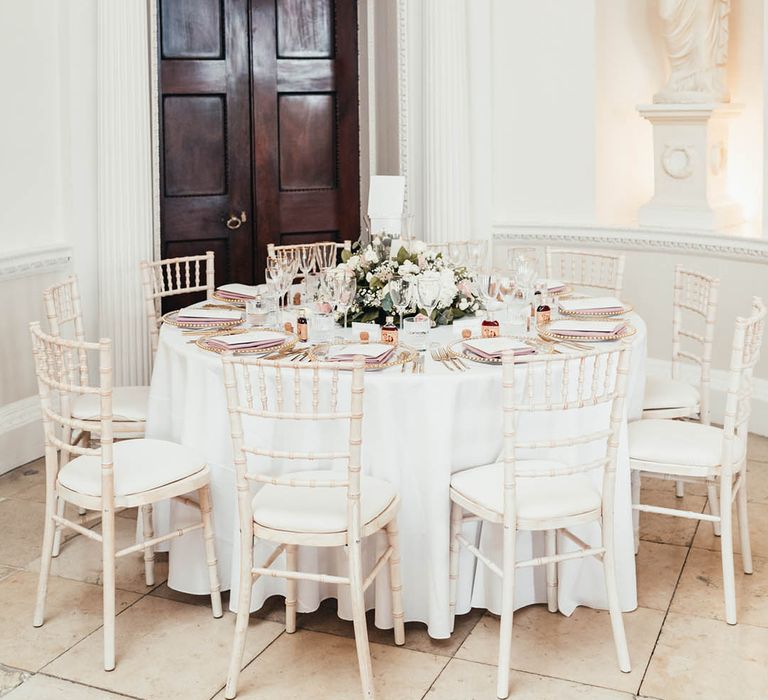 Classic and traditional style wedding table settings at Kirtlington Park House with white, pink and gold colour scheme 