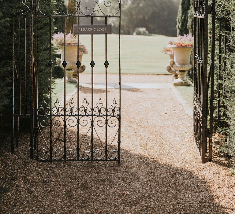 Black iron gate entrance to Hedsor House wedding venue 