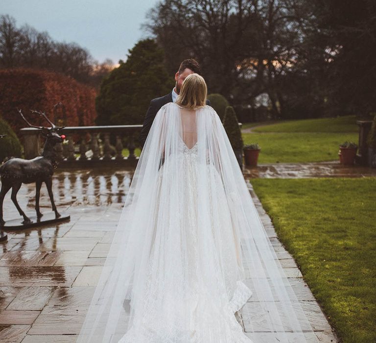 Sheer bridal cape with an embroidered lace edge