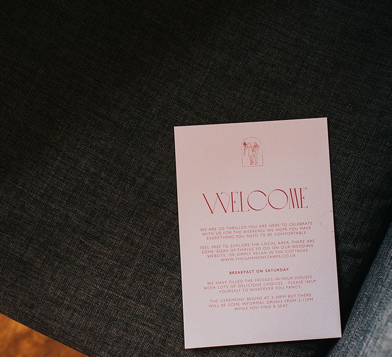 Pale pink and red wedding stationery welcome cards 