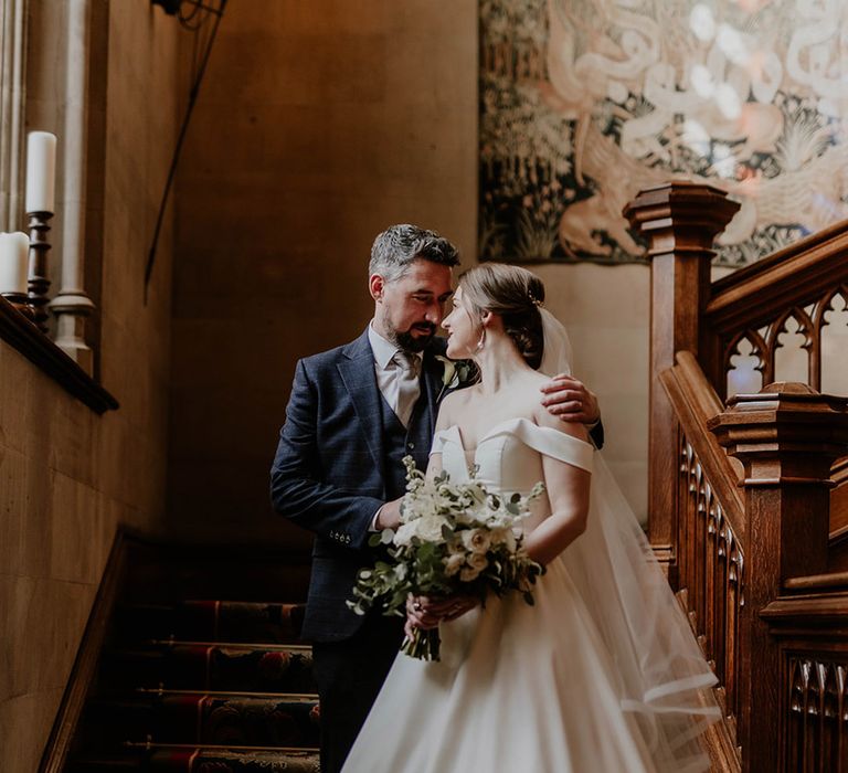 Bride and groom embrace on their wedding day 