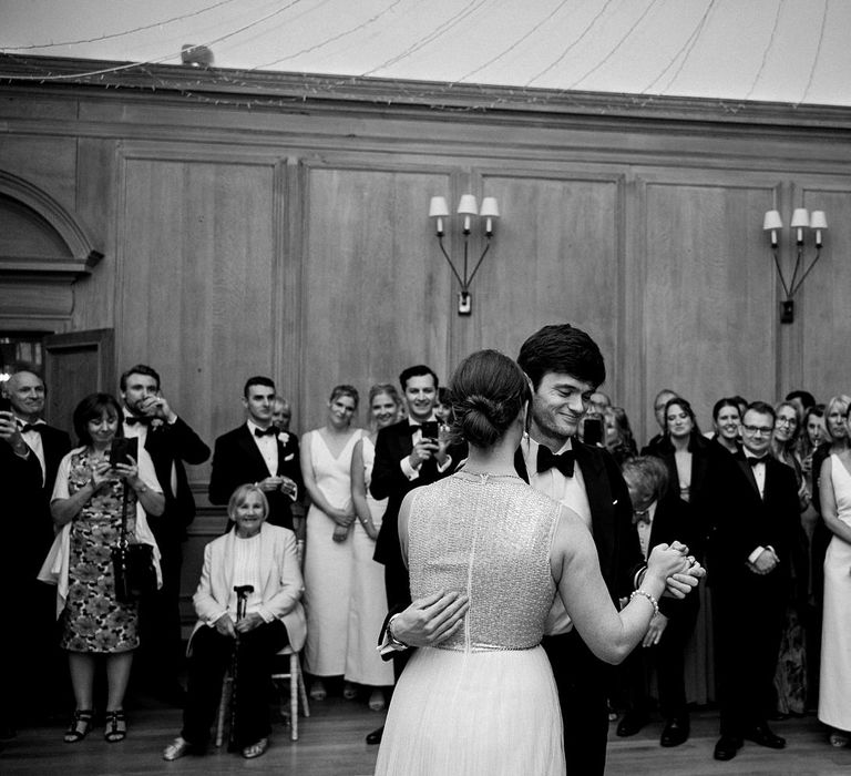 Bride & groom have their first dance at Findon Place as wedding guests watch 