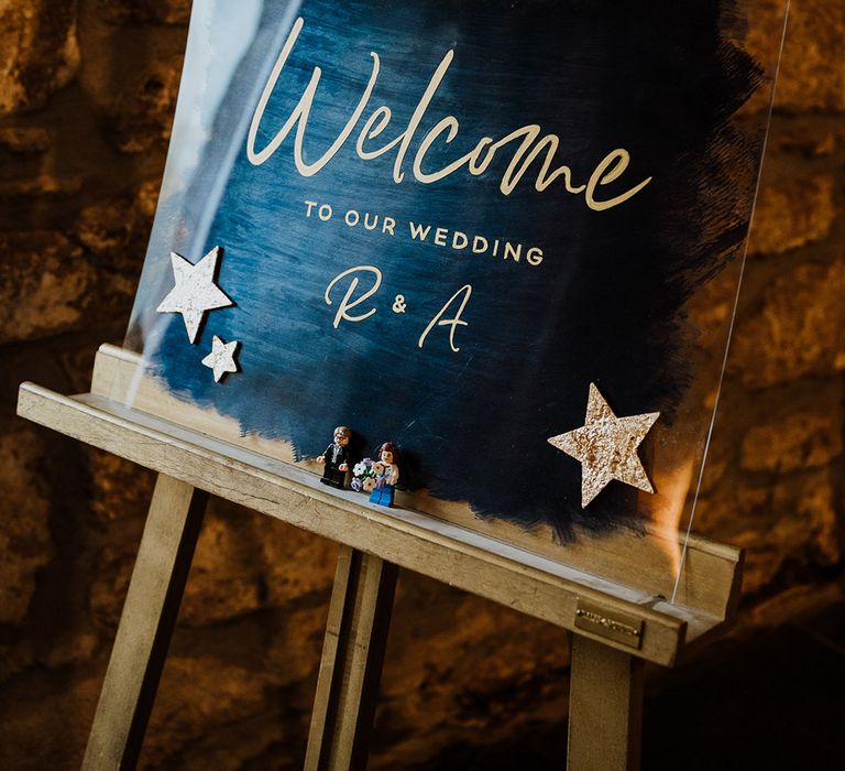 Blue and gold acrylic wedding welcome sign for the winter celestial theme wedding in February 