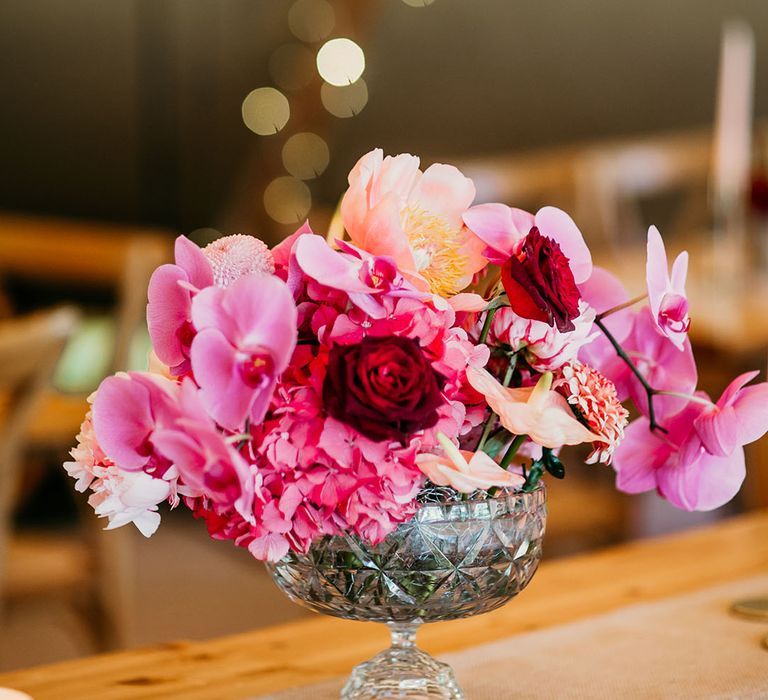 Orchid, roses and hydrangeas with pink and red wedding flowers 