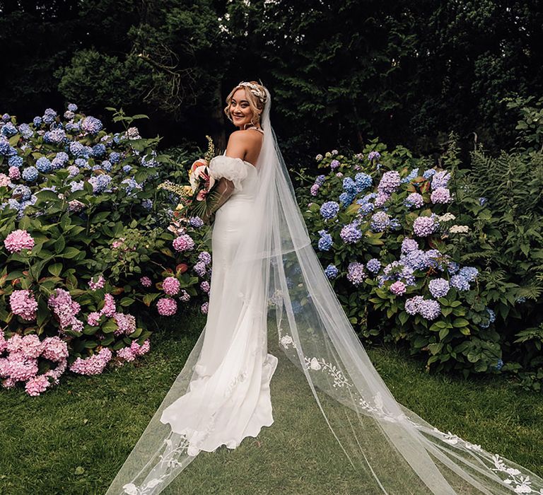 Bride wearing cathedral length embroidered edge veil for Wyresdale Park wedding 