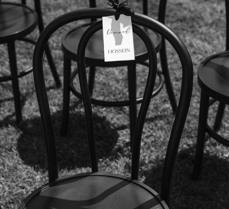 Reserved seat tags for chairs at wedding 