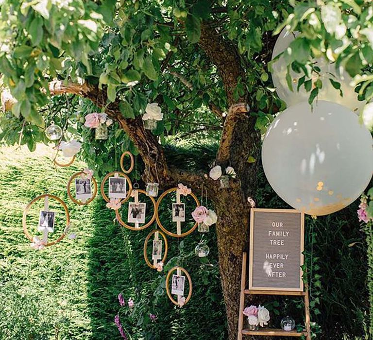 DIY family photo tree made with Hobbycraft materials beautifully laid out at wedding ceremony