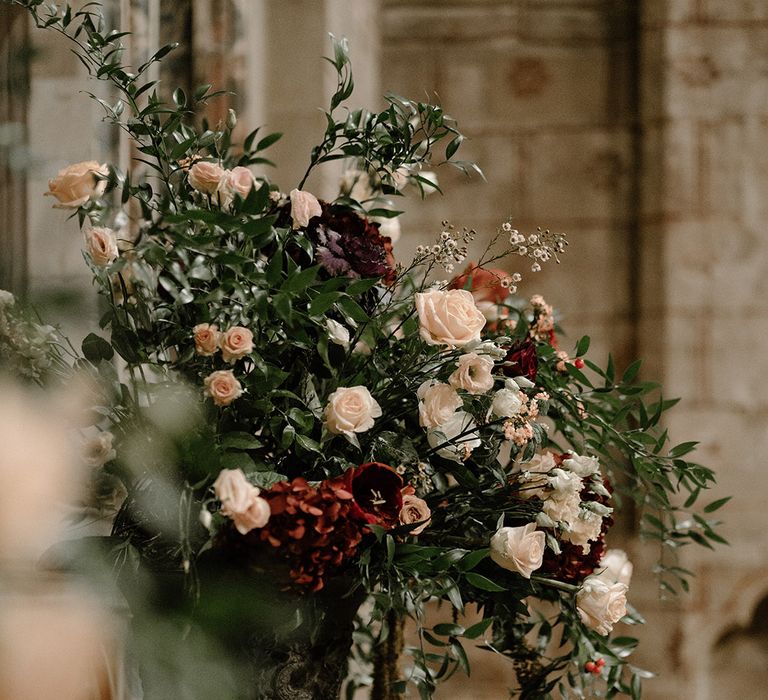 Traditional wedding flower arrangements for church wedding with light pink roses 