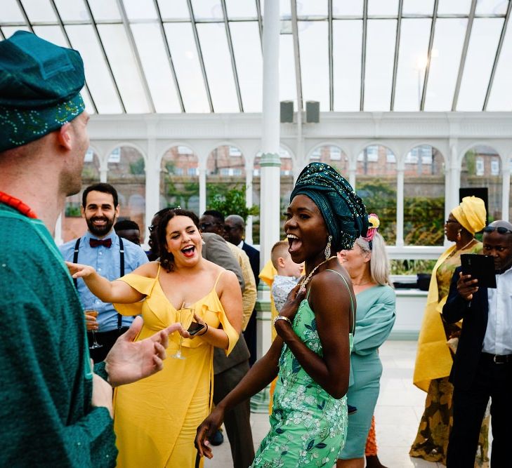 Bride and groom dancing at traditional Nigerian money dance