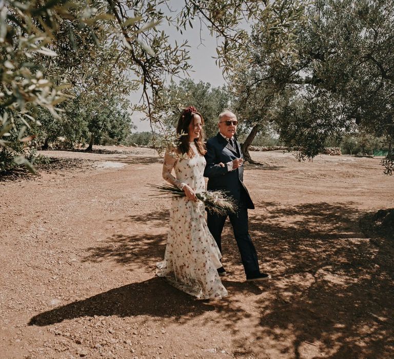 Bride walks down the aisle in Barcelona olive grove