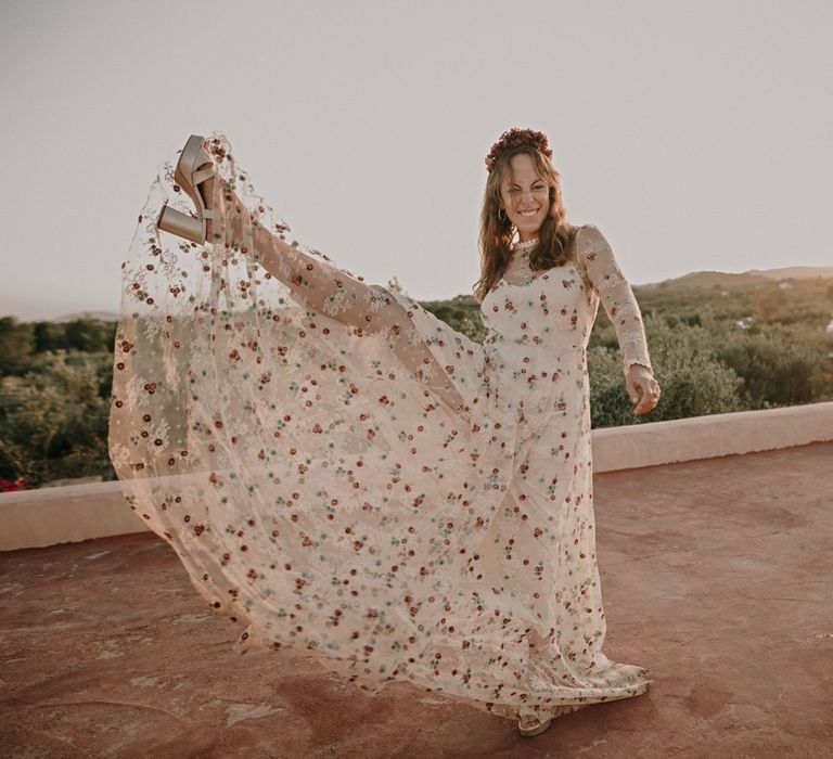 Bride celebrates in platform heels and floral Immacle dress