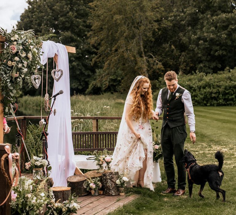 Bride & groom at Houghton Lodge Gardens with black Labrador 