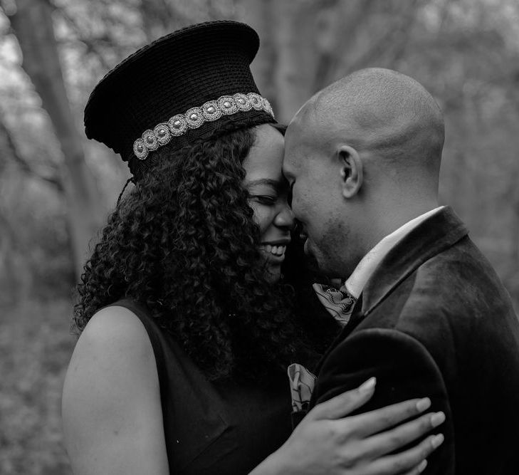 Bride and groom kissing at intimate wedding 