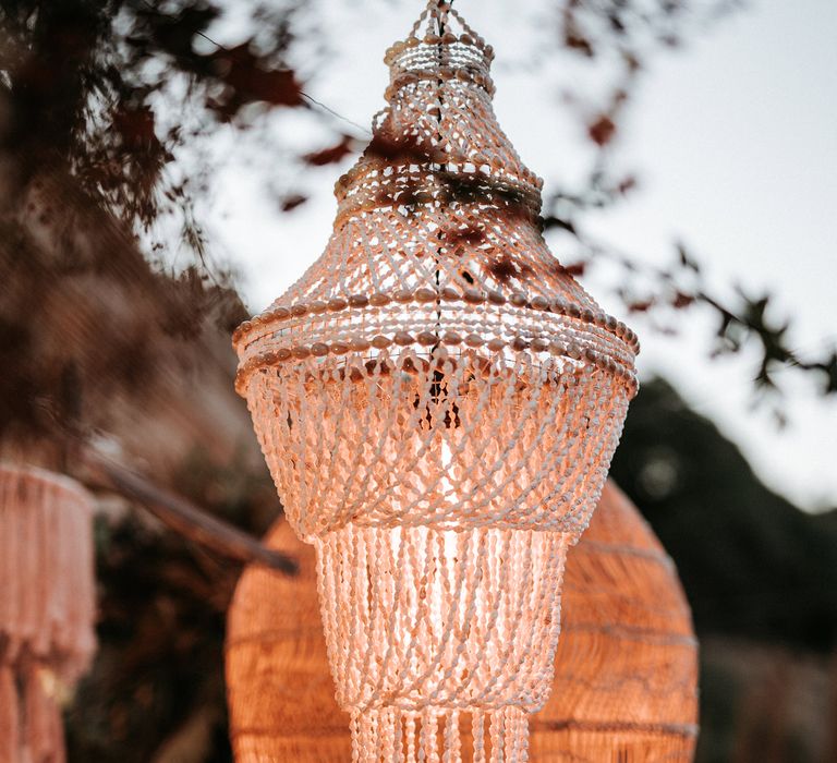 Shell and macrame chandelier wedding decor 