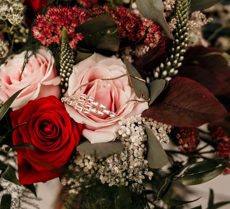 Pink and red roses with green foliage