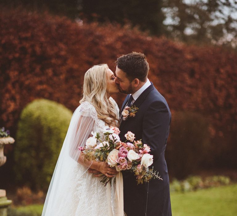 Bride and groom portrait in the grounds at Goldsborough Hall wedding