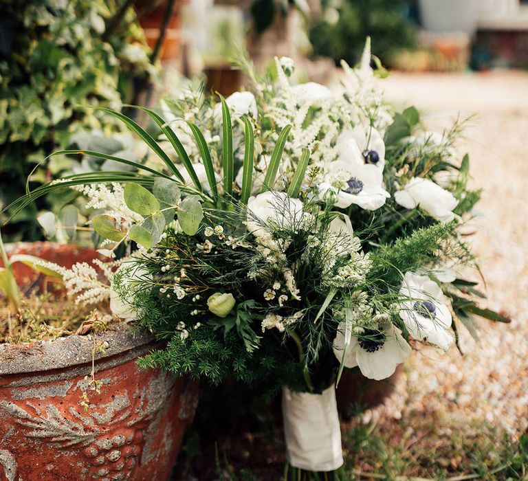 Botanical wedding bouquet with white flowers, fern and mixed green foliage