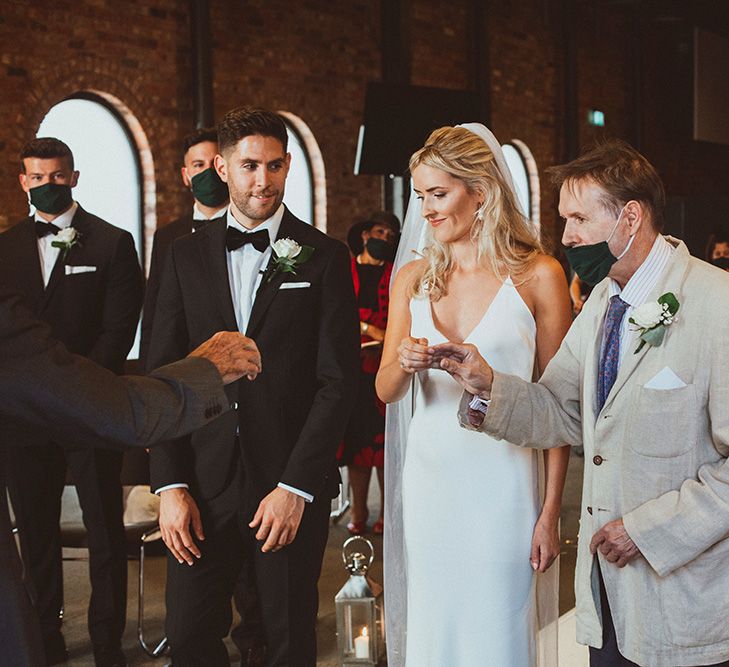 Father of the bride giving his daughter away at the church altar 