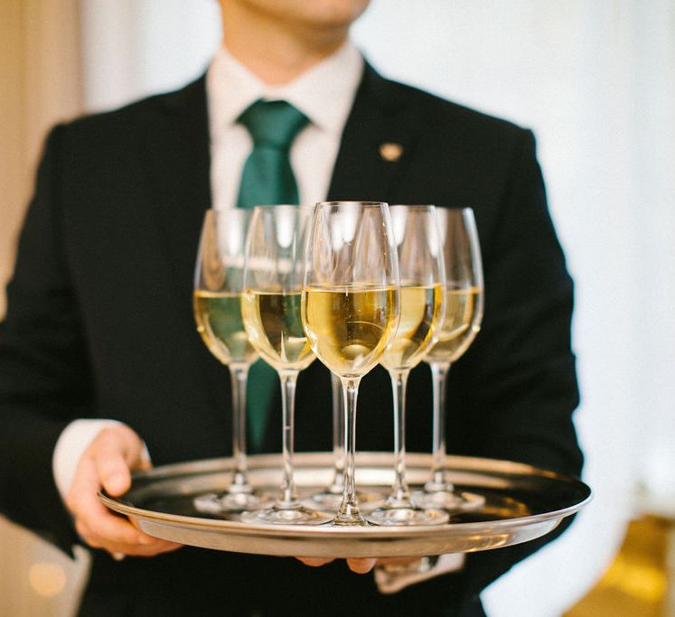 Silver tray filled with Champagne flutes