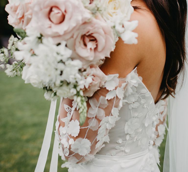 Blush pink and white orchid, rose and peony wedding bouquet