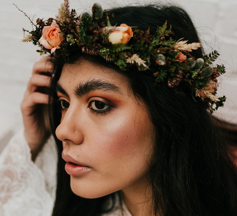 Bridal makeup with brown blusher and eyeshadow and a delicate flower crown 