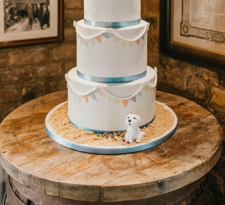 Four tier wedding cake complete with nautical theme and fondant dog