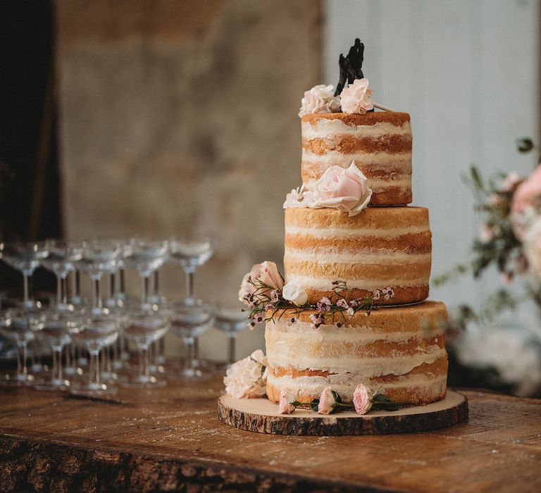 Naked wedding cake with fresh rose wedding decor 