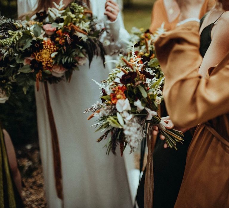 Bridesmaid wears silk dress in caramel colour