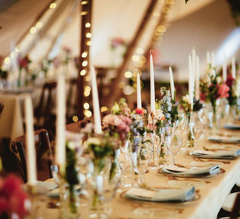 Rustic and colourful tipi complete with gold candle holders